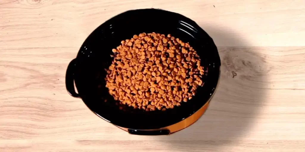 peanut butter chips into the crockpot