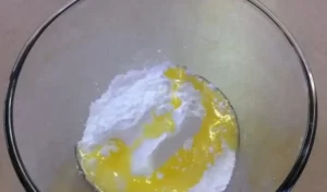 powdered sugar, butter, and corn syrup in a bowl
